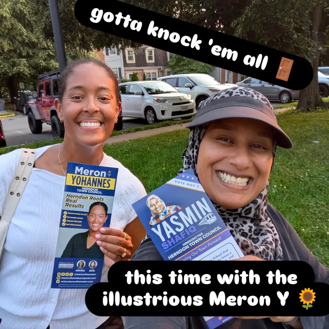 Yasmin Shafiq and Meron Yohannes smiling while door knocking in Herndon, holding each other's campaign flyers